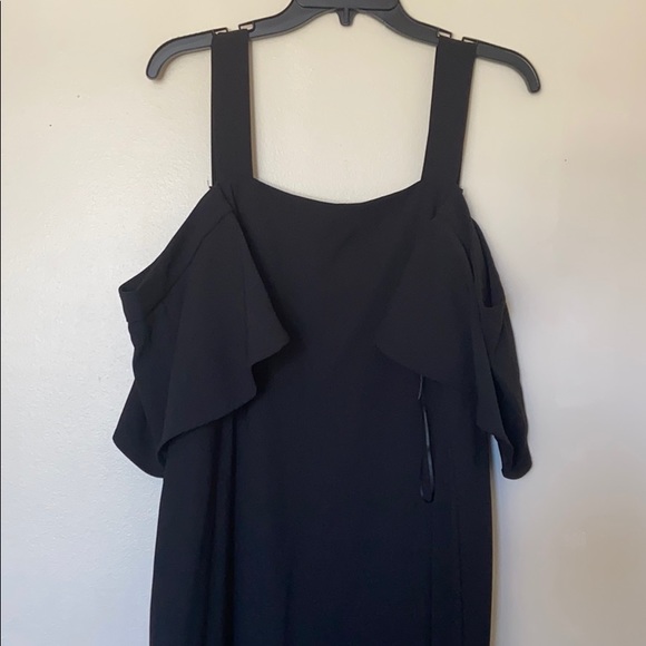 A black Asymmetrical dress. - Picture 3 of 5